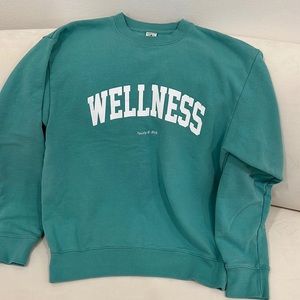 Sporty and Rich Wellness logo crewneck